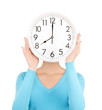 businesswoman with clock over her face
