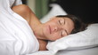 Portrait of a young girl sleeping on a pillow