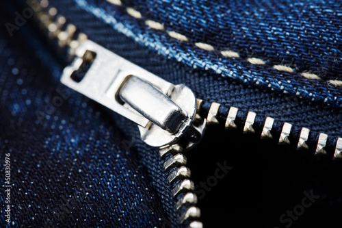 Photo: Close-up from blue jeans with zipper Close-up from blue jeans with zipper