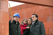 Architect on site with a young family