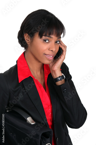 Photo: Businesswoman speaking to client over the telephone Businesswoman speaking to client over the telephone