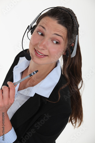 Photo: Cheerful brunette call-center worker Cheerful brunette call-center worker