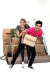 Playful couple moving house