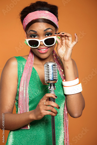 Photo: Vintage soul funk woman singing. Black african american. Vintage soul funk woman singing. Black african american.