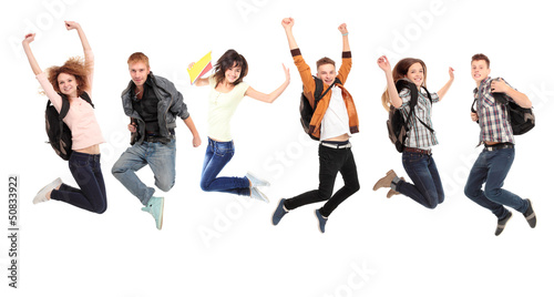 Photo: Happy young caucasian people jumping into the air Happy young caucasian people jumping into the air