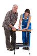 Young woman tinkering with her father