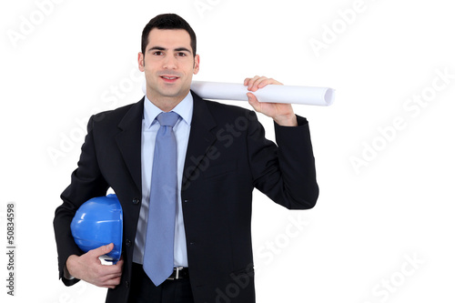 Photo: Businessman holding a blueprint Businessman holding a blueprint