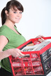 young girl carrying box