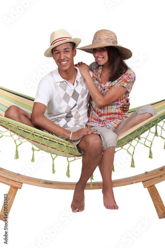 Photo: Teenagers in a hammock Teenagers in a hammock