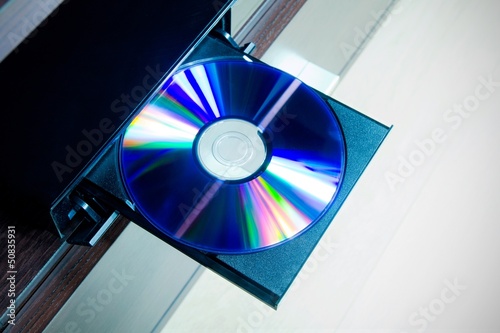Photo: Disc insterted to DVD or CD player Disc insterted to DVD or CD player
