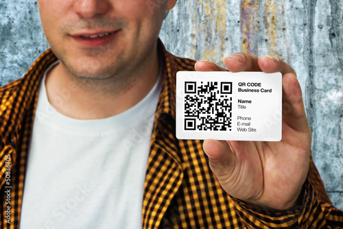 Photo: Construction worker with QR code business card Construction worker with QR code business card