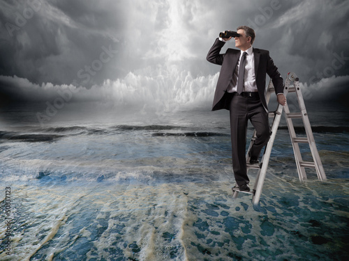 Photo: Businessman with binoculars. Businessman with binoculars.