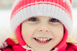 Beautiful happy kid in the red jacket
