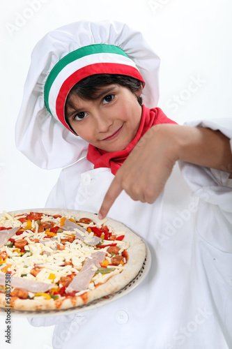 Photo: pizza boy carrying a pizza pizza boy carrying a pizza