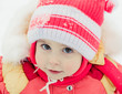 Beautiful happy kid in the red jacket