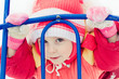 Beautiful happy kid in the red jacket