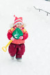 Kid digs snow shovel