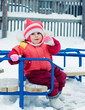 Beautiful happy kid in the red jacket.