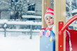 Beautiful happy kid in the red jacket