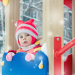 Beautiful happy kid in the red jacket