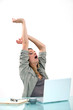 Woman yawning at desk
