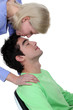 Woman kissing tenderly man on the forehead