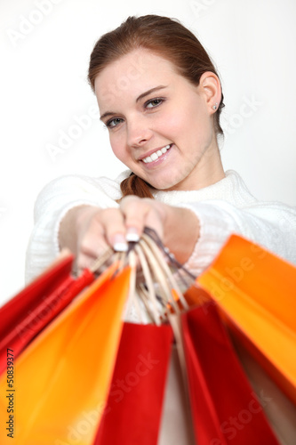 Photo: Woman holding lots of shopping bags Woman holding lots of shopping bags