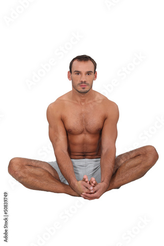 Photo: Fit man in the lotus position Fit man in the lotus position