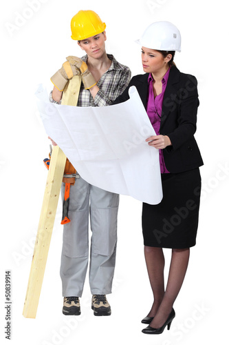 Photo: Female architect and carpenter Female architect and carpenter