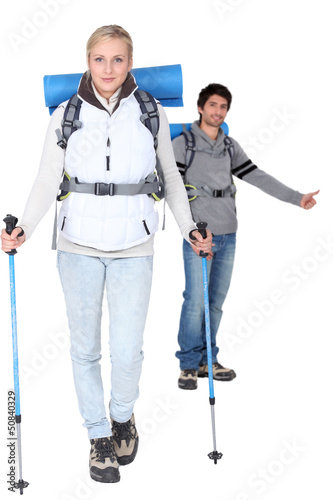 Photo: Studio shot of a hiking couple Studio shot of a hiking couple