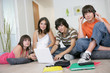 Foto: Teenagers hanging out with a laptop and listening to music Teenagers hanging out with a laptop and listening to music