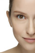 Beautiful young woman with clean skin of the face.