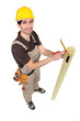 Carpinter measuring plank of wood