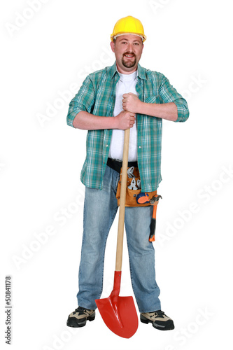 Photo: Artisan stood with shovel Artisan stood with shovel