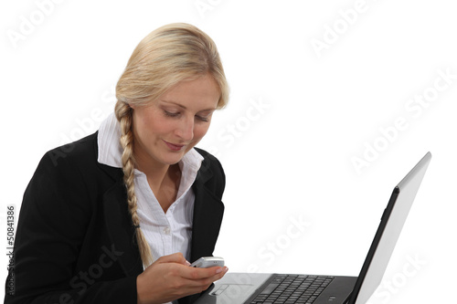 Photo: Office worker sending SMS Office worker sending SMS