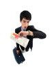 Stunned businessman looking at the time