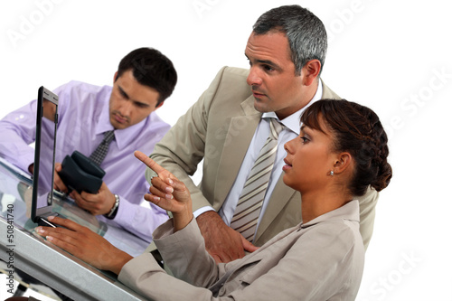 Photo: Three colleagues in meeting Three colleagues in meeting