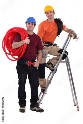 Photo: Two electricians working together Two electricians working together