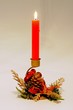 Red candle in Christmas holder © Arena Photo UK