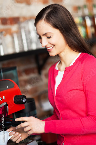 Photo: Female barista making coffee Female barista making coffee