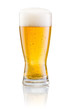 Glass of fresh beer with cap of foam isolated on white backgroun