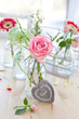 canvas print picture - Fresh flowers in little vintage bottles