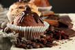 tasty muffin cakes with chocolate, spices and coffee seeds,