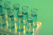 test-tubes with liquid on blue background