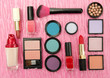 Decorative cosmetics on pink background