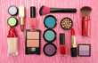Decorative cosmetics on pink background