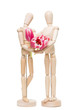 romantic wooden little men with tulips on isolated white