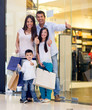 Family shopping with thumbs up
