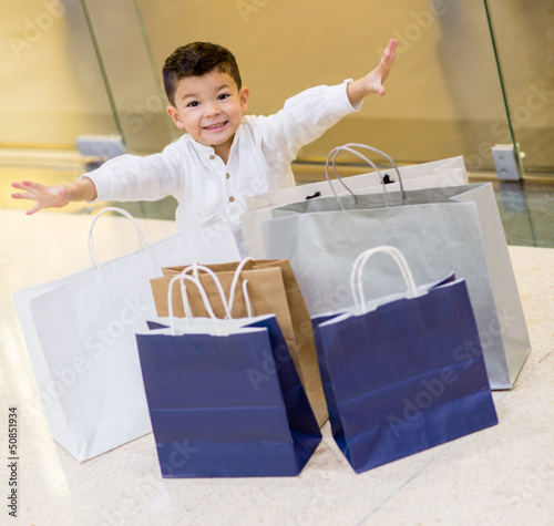 Photo: Excited shopping boy Excited shopping boy