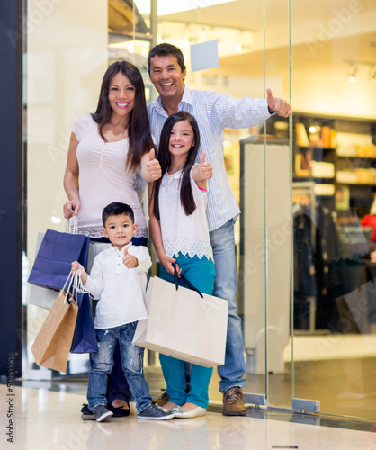 Photo: Family shopping with thumbs up Family shopping with thumbs up
